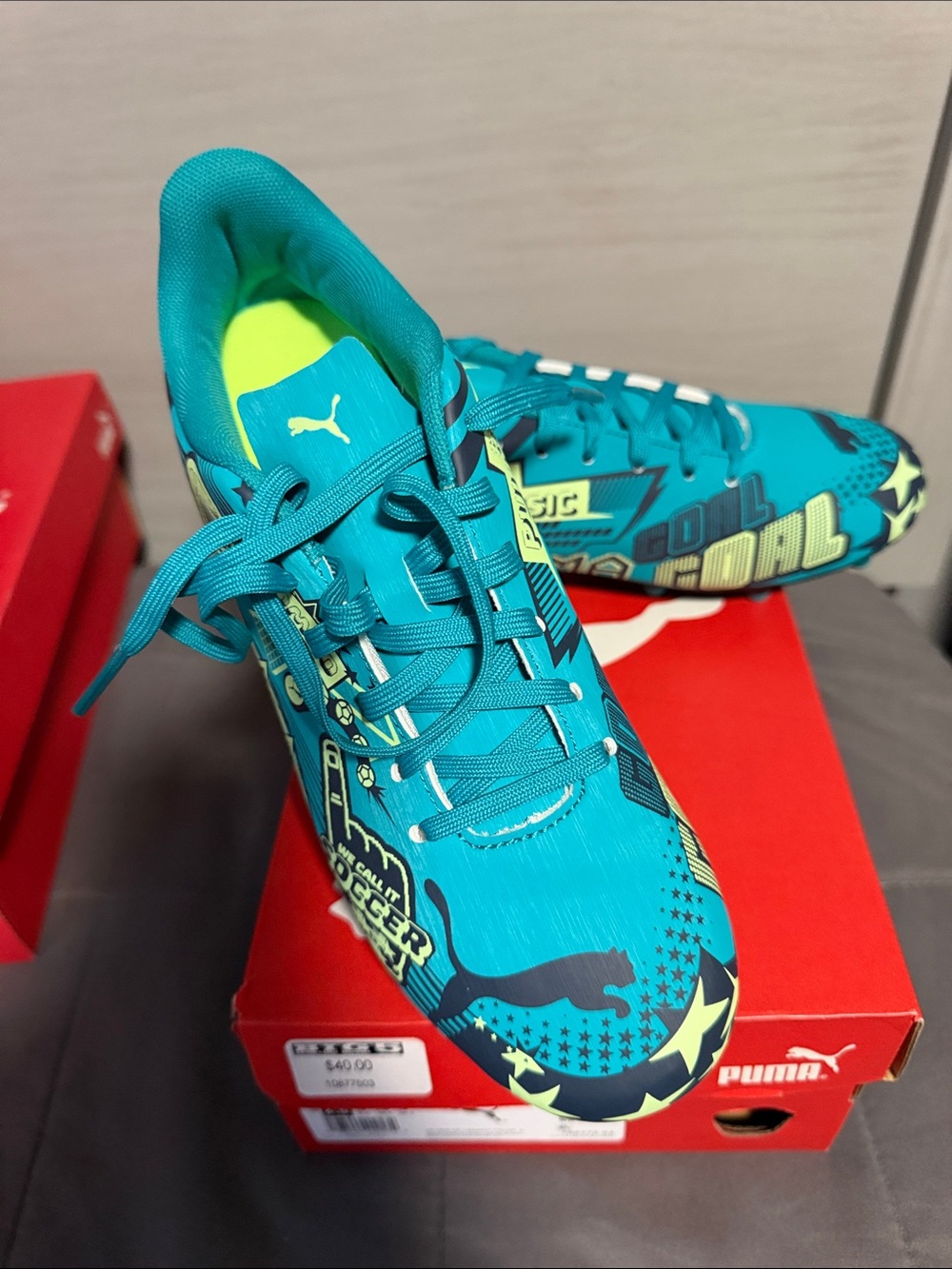 Puma Men’s Teal and Neon Yellow Graphic Soccer Shoes (JINIOR)